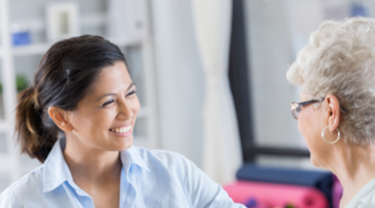 Young professional woman with older patient